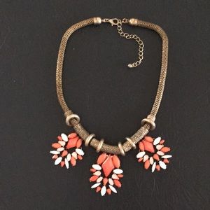 Gold, coral, and white necklace
